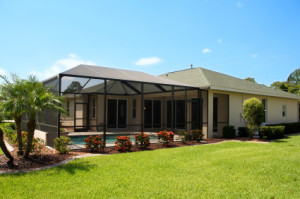 house with pool and screen enclosures