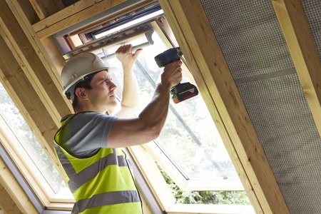 worker installing new window
